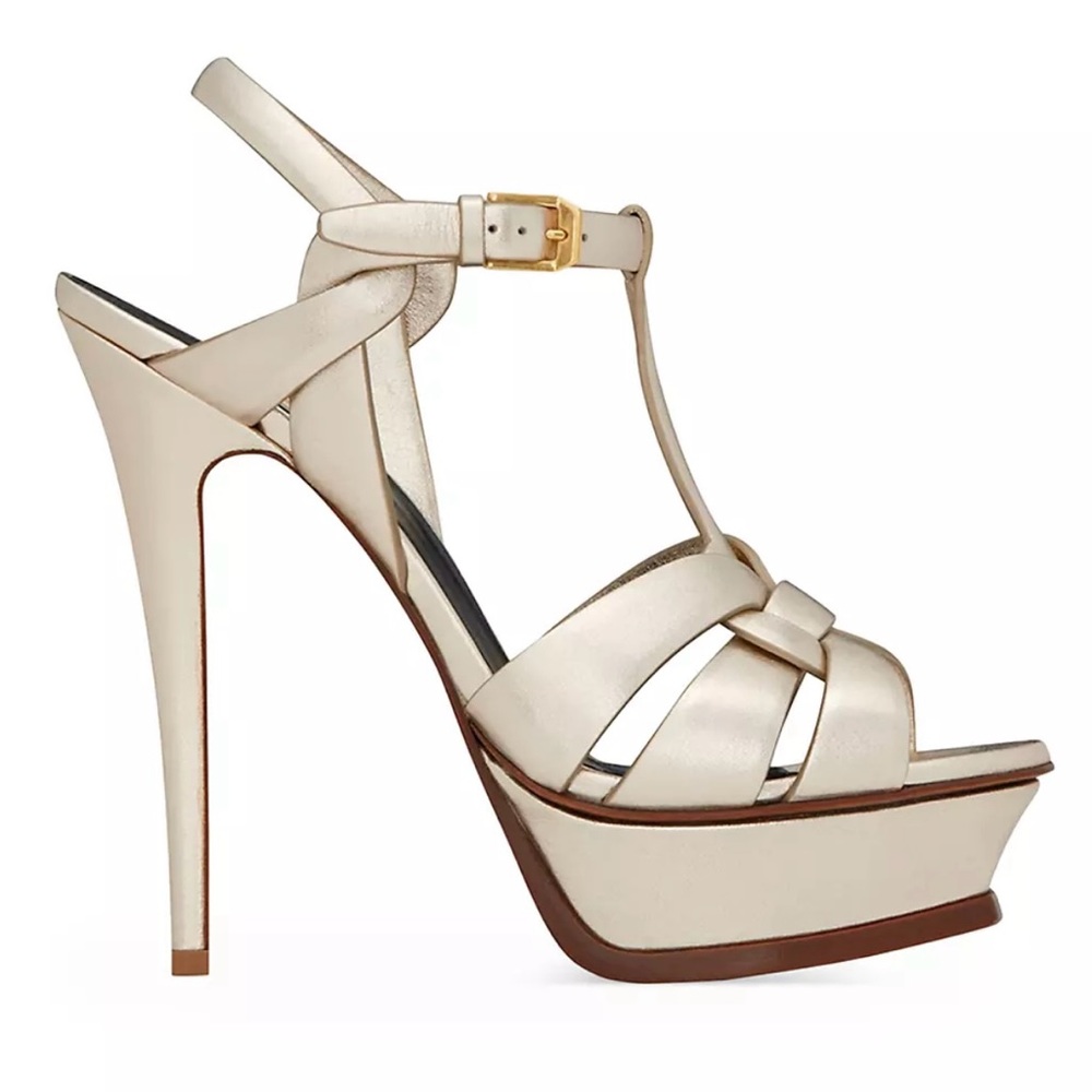 YSL Tribute sandals in gold leather.